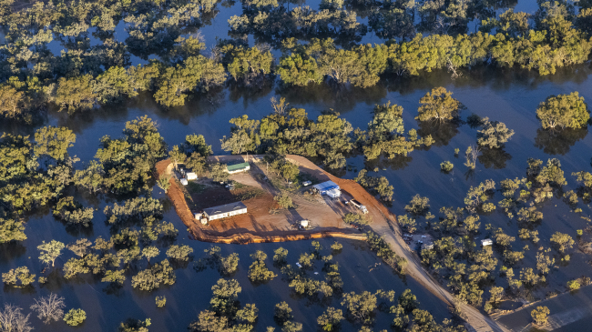 An aerial view of a property surrounded by flood water on December 9, 2022, in Louth, Australia. Prolonged flooding along the Barwon-Darling River and its tributaries due to unseasonably high rainfall turned vast swaths of the Western Plains into islands, cut off from road access. 2022 was the warmest La Nina year on record as increasingly extreme and changing conditions impacted the globe.