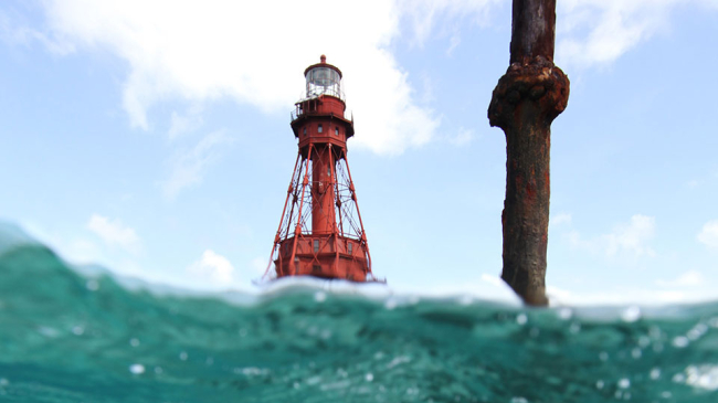 The rusty remnants of a Totten Beacon (foreground) located near American Shoal lighthouse. 