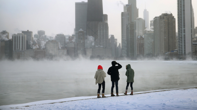 Image showing mist rises from Lake Michigan at North Avenue Beach as temperatures dipped well below zero on January 6, 2014 in Chicago, Illinois. Chicago hit a record low of -16 degree Fahrenheit this morning as a polar air mass brought the coldest temperatures in about two decades into the city. Credit: Getty Images.