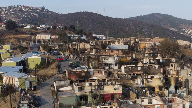 FEBRUARY 4, 2024: An aerial view of destroyed houses at Villa El Olivar in the wake of forest fires in Vina del Mar, Chile. At least 1,300 homes were destroyed as unusually high temperatures of 40 degrees C (104 degrees F) hit the country. South America sweltered through its warmest February on record in 2024.