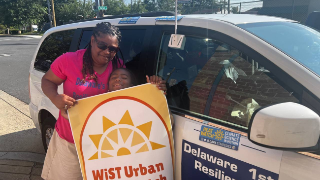 Photo showing Stacey Henry, founder of the Delaware Resilience Hub, and her daughter, Mylee, volunteered to collect temperature, humidity, time and location data for the 2023 NOAA-supported Urban Heat Island mapping campaign in Wilmington, Delaware and surrounding townships. They joined other volunteers who attached sensors to their cars to collect the data that was used to create a detailed map of the hottest areas in their community.