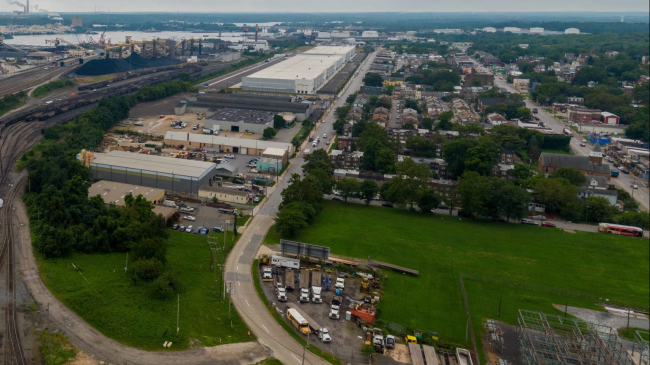 View of Curtis Bay and surrounding areas facing south; shot from a drone in August 2023 before the collapse. The location of the Francis Scott Key Bridge is just to the East of this neighborhood, across the water and just out of view. 