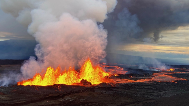 This aerial photograph shows the dominant fissure erupting on the Northeast Rift Zone of Mauna Loa, taken at approximately 8 a.m. Hawaii Standard Time on November 29, 2022. Lava fountains were up to 25 m (82 ft) that morning and the vent was feeding the main lava flow to the northeast.