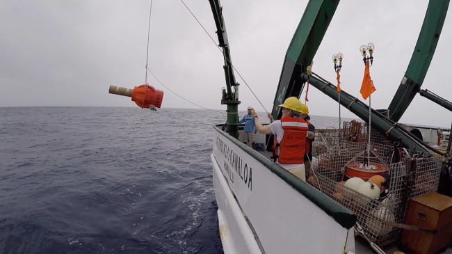 Scientists deploy a Deep Argo float in 2018 from Research Vessel Kaʻimikai-O-Kanaloa at the Pacific Ocean off Hawaii. The ocean robot will track ocean temperature, salinity and other data down to 3 to 4 miles deep in the ocean.