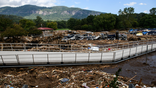 LAKE LURE, NORTH CAROLINA - SEPTEMBER 28, 2024: The Rocky Broad River flows into Lake Lure and overflows the town with debris from Chimney Rock, North Carolina, after heavy rains from Hurricane Helene. Approximately six feet of debris piled on the bridge from Lake Lure to Chimney Rock, blocking access. (Photo by Melissa Sue Gerrits/Getty Images)