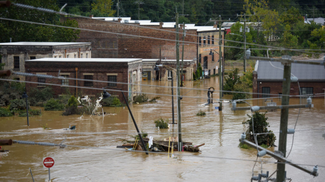 A heavily flooded street and partially submerged buildings in Asheville, North Carolina, on September 28, 2024, following Hurricane Helene.