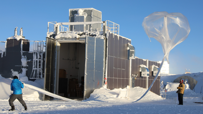 Scientists launch a NOAA ozonesonde, frost point hygrometer, and POPS aerosol particle counter on a balloon to help monitor the Antarctic Ozone Hole on October 5, 2024 at the Amundsen-Scott South Pole Station. Photo credit: William Brotman/United States Antarctic Program.