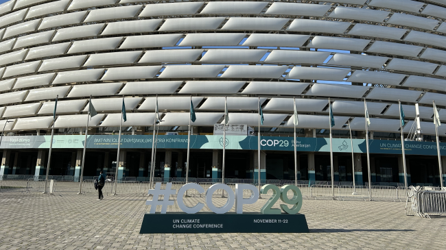 A photo of the venue for the COP29 U.N. climate summit in Baku, Azerbaijan with signage.