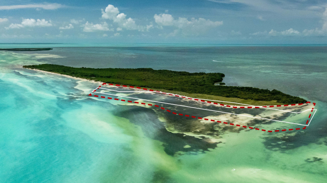 Aerial image of a small island with red and white boundary lines