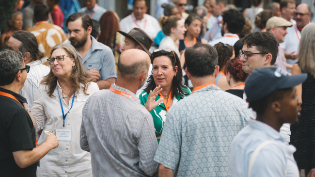 Photo showing Ashley Ward (center), director of the Duke University Heat Policy Innovation Hub, greets participants at the HeatWise Policy Partnership Summit organized by Duke University in June 2024: Credit: Ashley Stephenson.