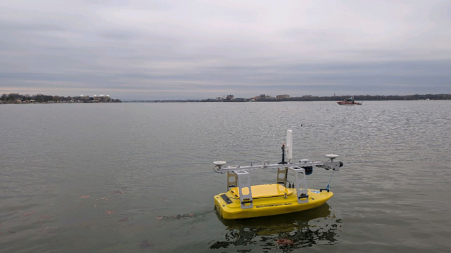 An uncrewed NOAA surface vessel on the Potomac surveying the river bed for debris. Credit: John Gray/NOAA.