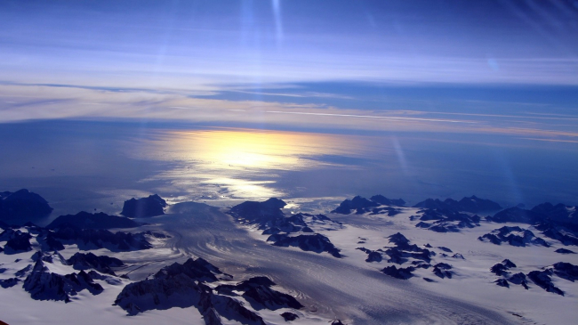 Greenland's Steenstrup Glacier with midmorning sun glinting off the Denmark Strait in 2016.