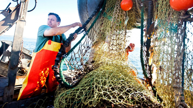 Commercial fisherman, Chris Brown, aboard his fishing boat. 