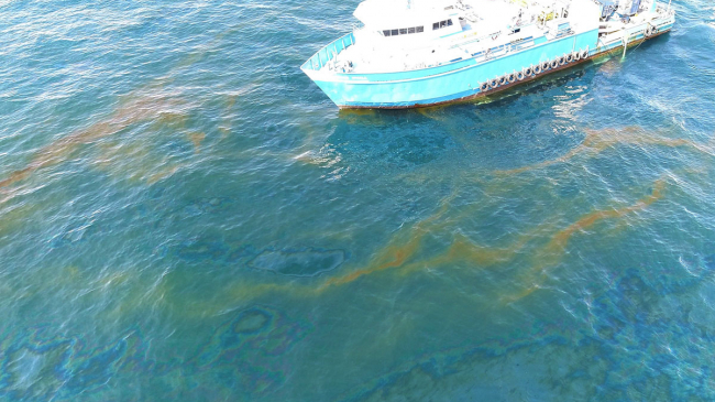Drone image of R/V Brooks McCall at MC20 site with rising oil and gas at the surface, September 2018, in the Gulf of Mexico. NOAA NCCOS scientists aboard the vessel surveyed the site (September 1–7, 2018) to determine the source, composition, and extent of the oil and gas discharge.
