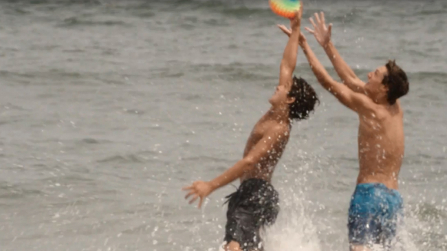 Play it safe story map opening. Two boys playing at the beach.