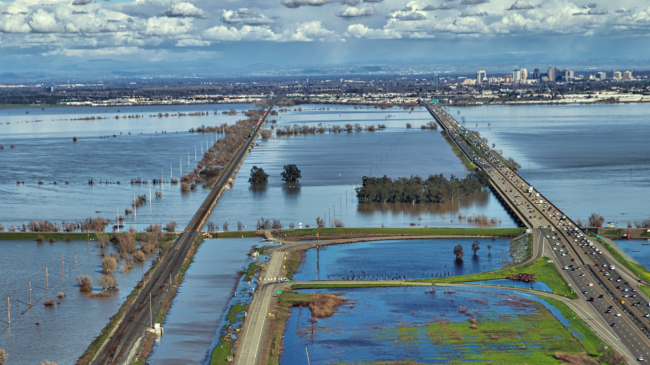 High water spills out of the Yolo flood bypass near Sacramento, February 23, 2017. California had its 2nd wettest winter on record, resulting in extensive flooding in many river valleys and record snowfall in mountain areas. 