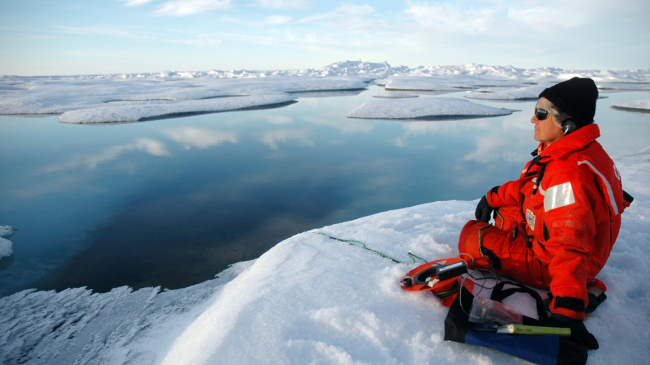 Alaska, Beaufort Sea, north of Point Barrow, 2009: Sue Moore, Ph.D, a NOAA Arctic Research scientist, uses a hydrophone to listen for whales and other marine mammals.