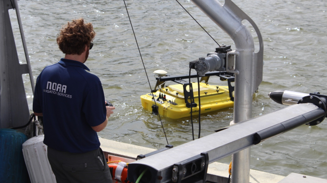 An autonomous surface vehicle is launched in the Port of Gulfport, Miss., during the U.S. Navy's Advanced Naval Technology Exercise on November 6, 2019. 