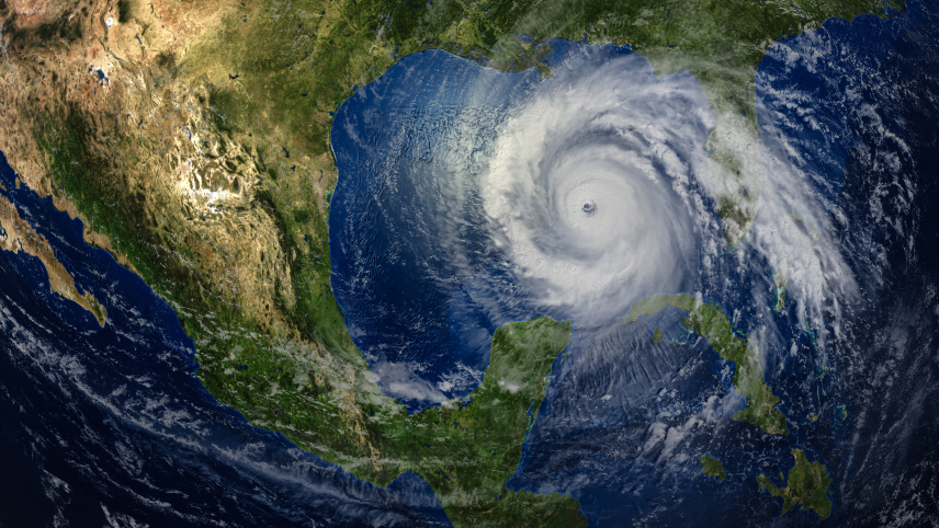Satellite view of a large hurricane over the Gulf of Mexico, with an eye and swirling clouds extending across the Gulf Coast, the southern United States, and parts of Mexico