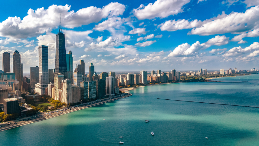  aerial view of Chicago skyscrapers and blue waters of Lake Michigan