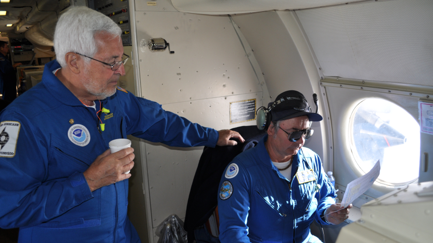 Dr. James McFadden (left) aboard a NOAA Lockheed WP-3D Orion May 6, 2011 during the 2011 Hurricane Awareness Tour.