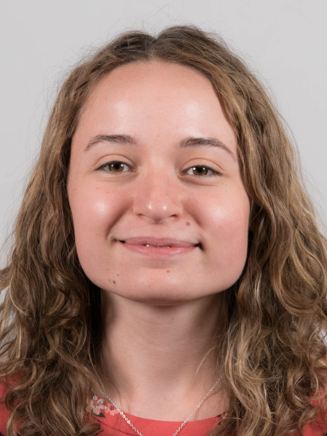 A headshot of Abby Charlton.