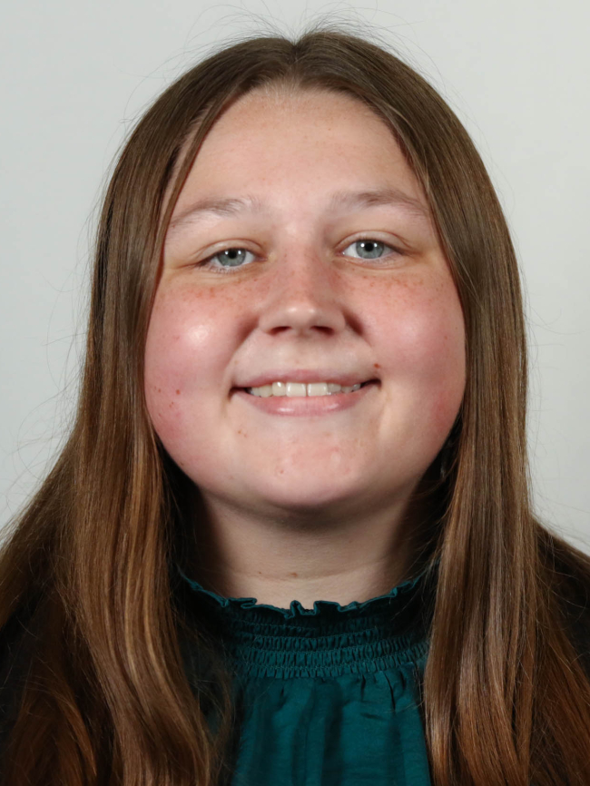 A headshot of Ainsley Cain.