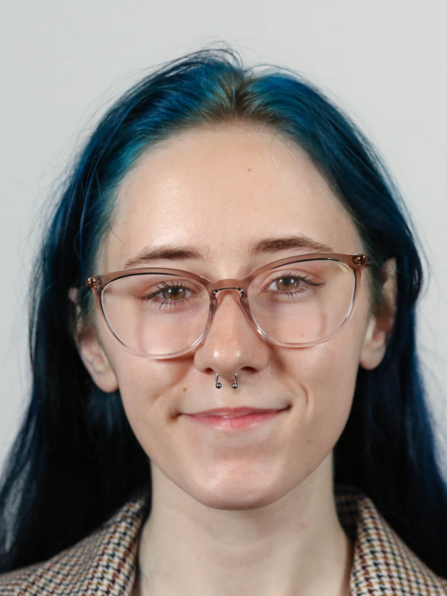 A headshot of Alexis Watkins.