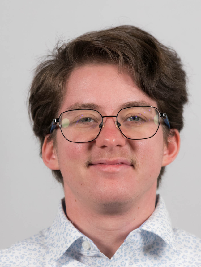 A headshot of Asher Wescott.