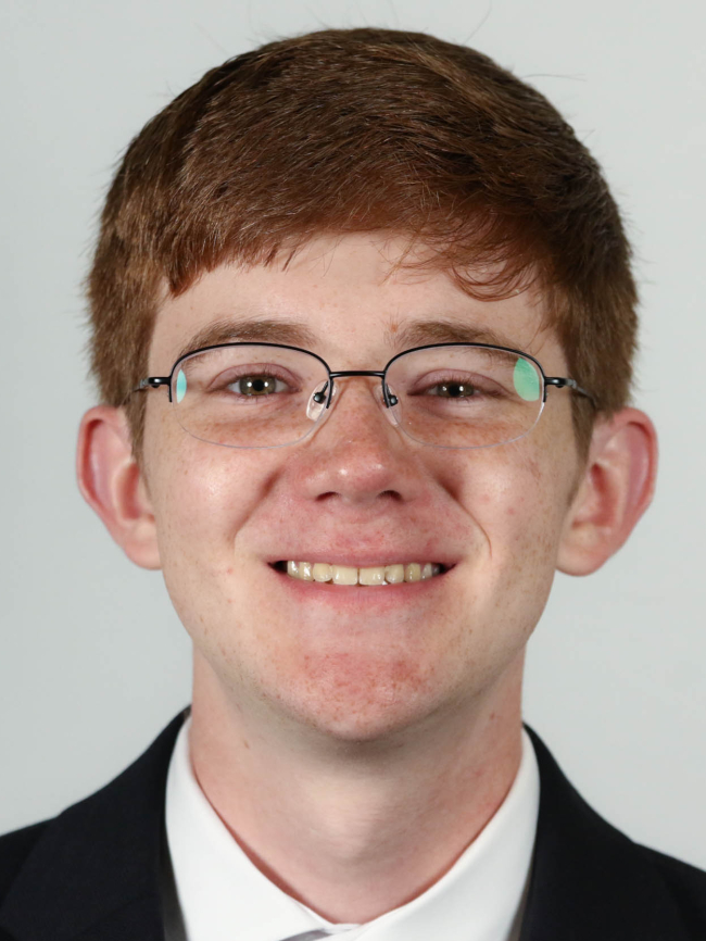 A headshot of Benjamin Moose.