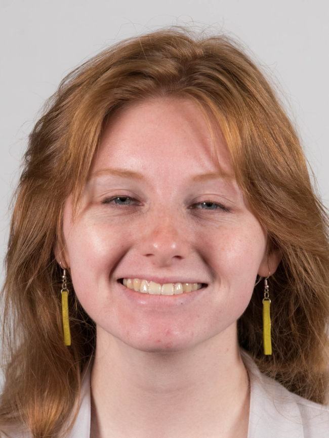 A headshot of Cameron Stacey.