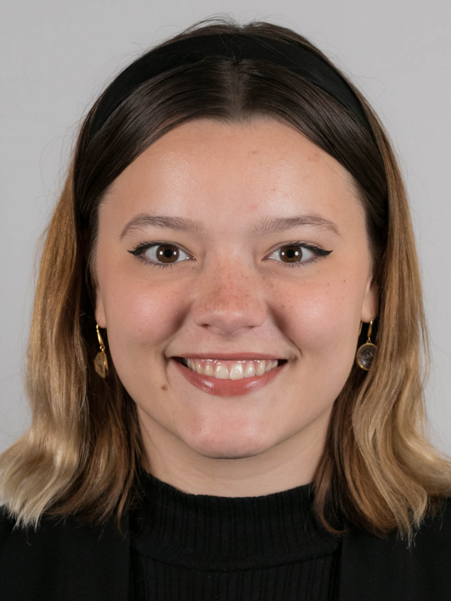 A headshot of Emma McGuire.
