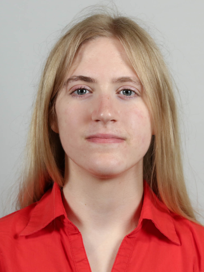 A headshot of Grace Veenstra.