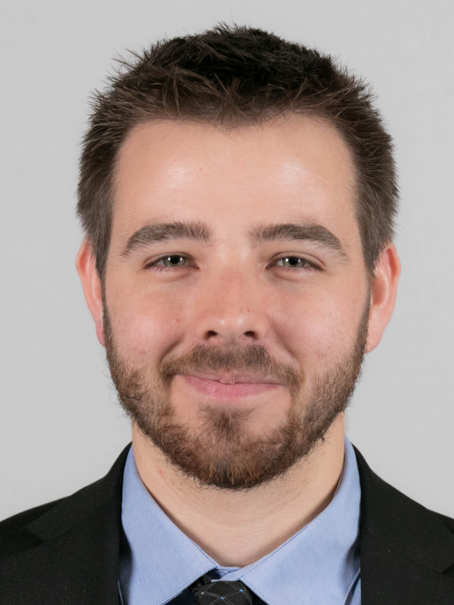 A headshot of Michael Self.