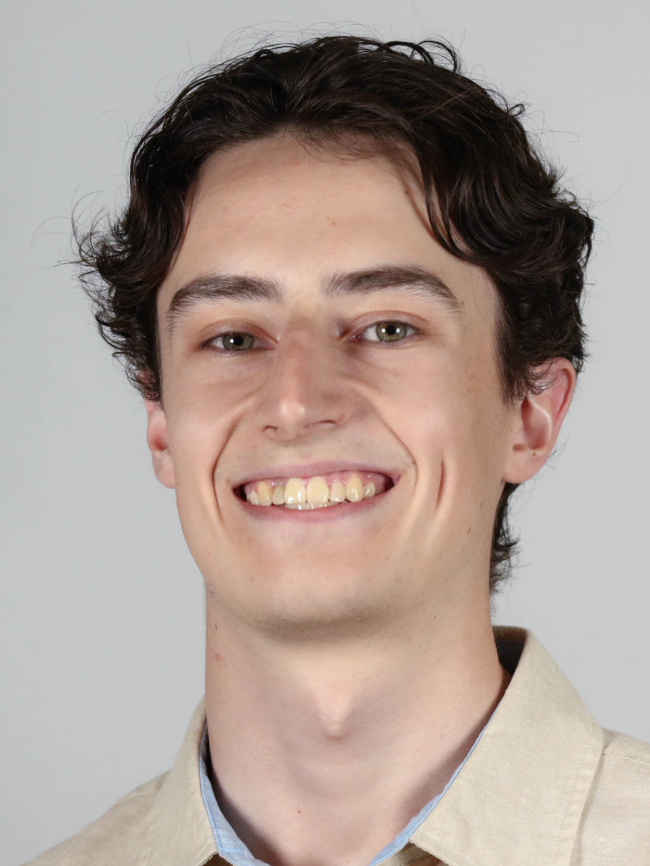 A headshot of Miles Dailey.