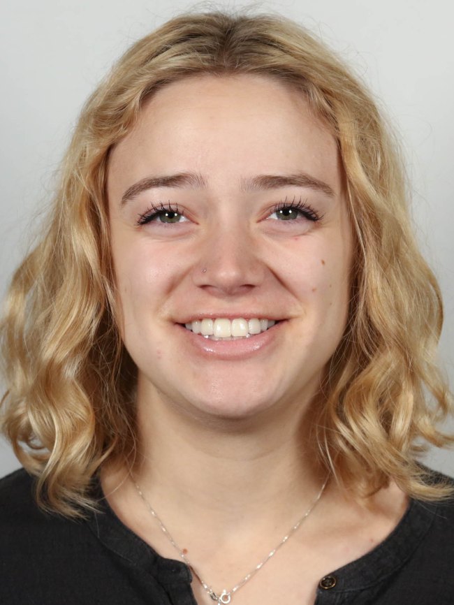 A headshot of Taya Ambrose