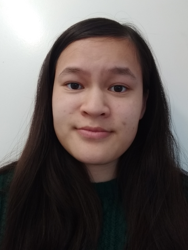 A headshot of Ricarda Hill.