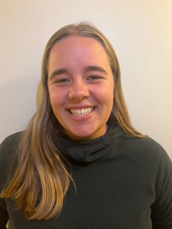 A headshot of Ellie Madigan.