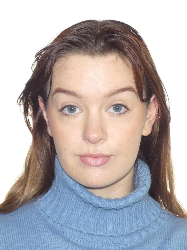 A headshot of Justine McOuat.