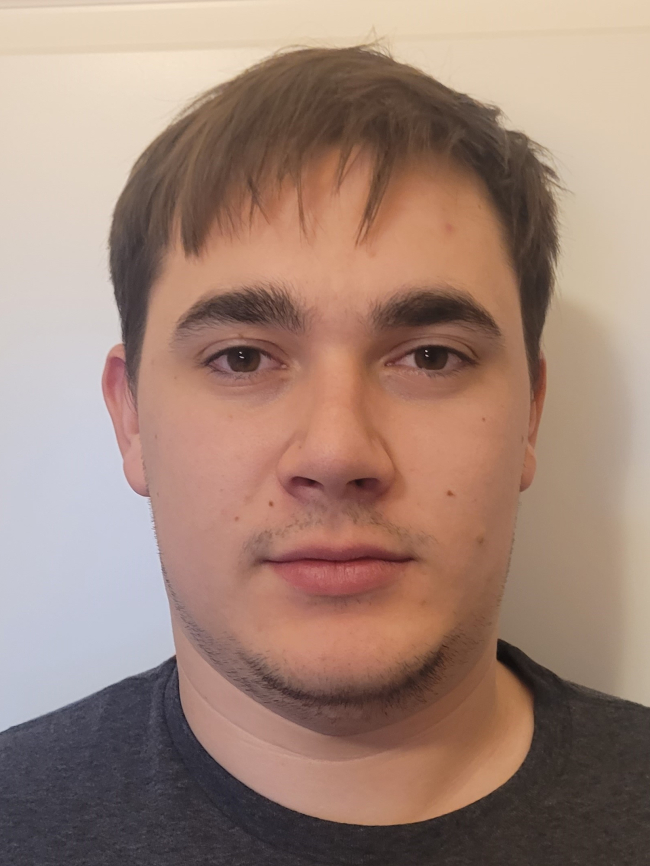 A headshot of Sayre Satterwhite.