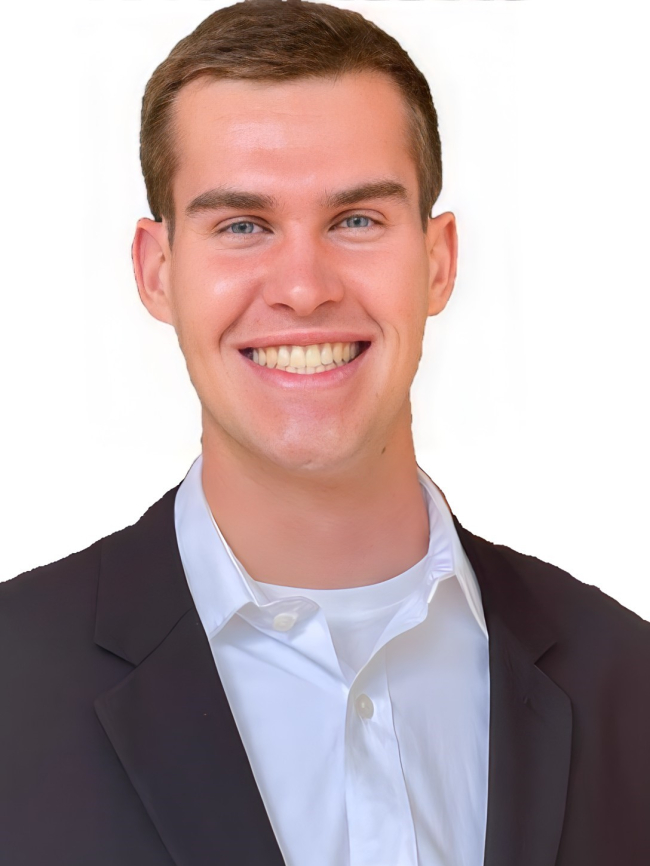 A headshot of Derek Sprincis.