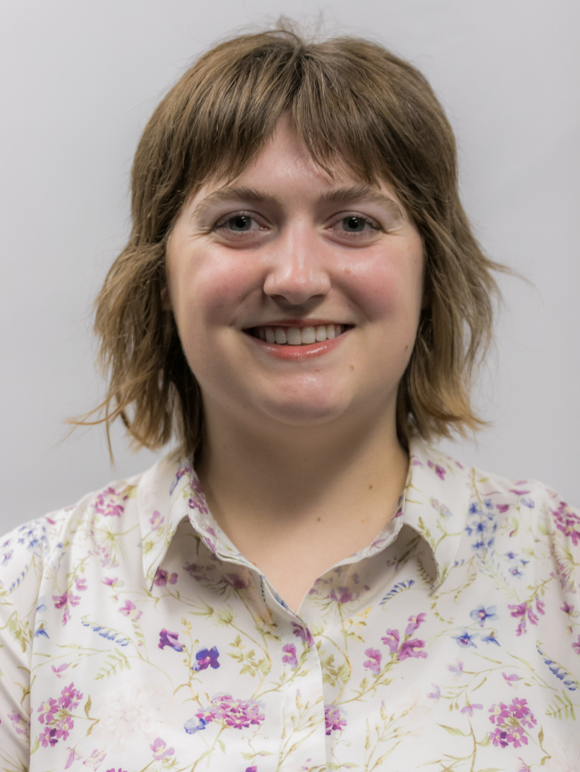 A headshot of Andie Forbes.