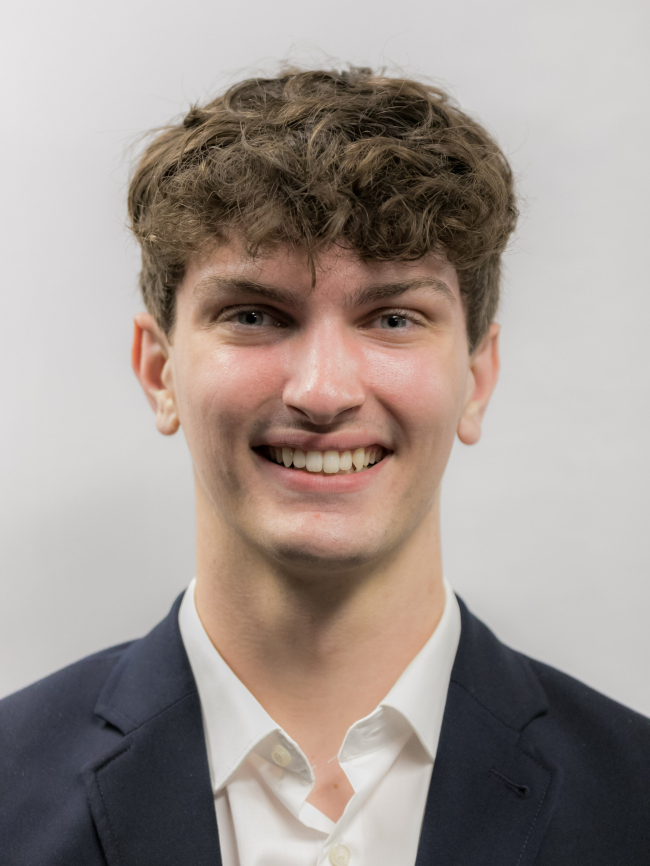 A headshot of Mitchell Foster.