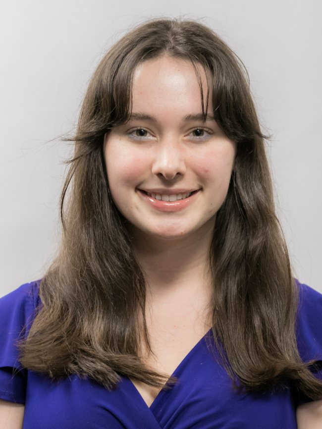 A headshot of Cora Jackson.