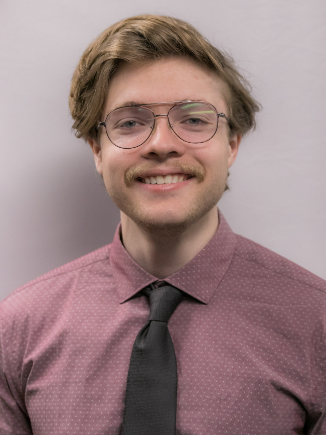 A headshot of Caleb Jansen.