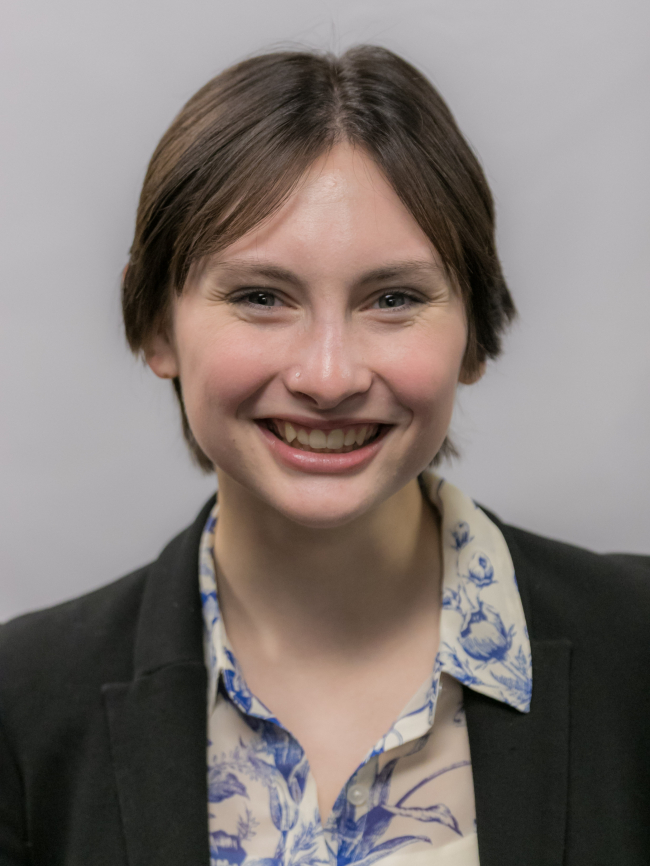 A headshot of Emma Knudson.