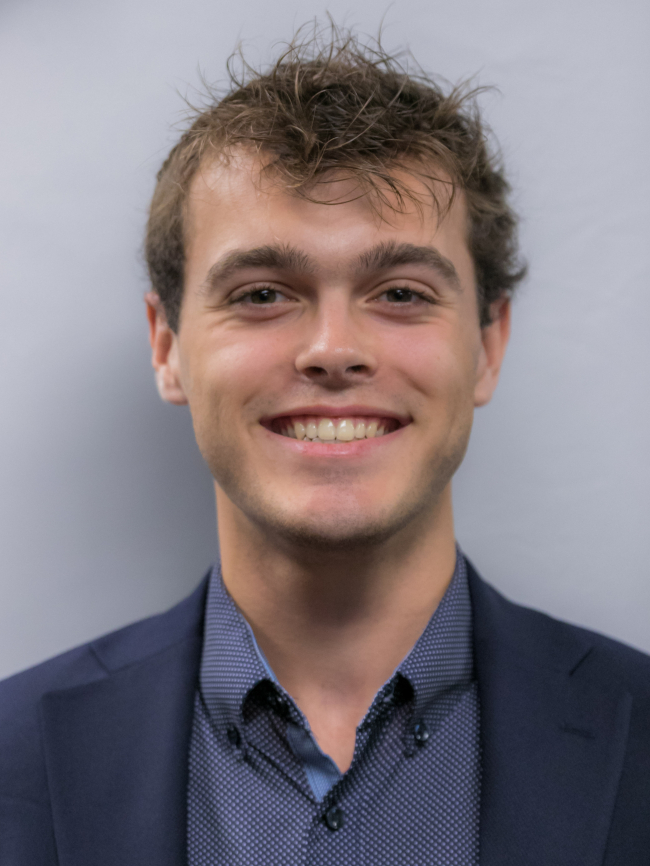 A headshot of Liam McKenna.