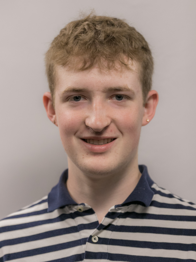 A headshot of Andrew Price.