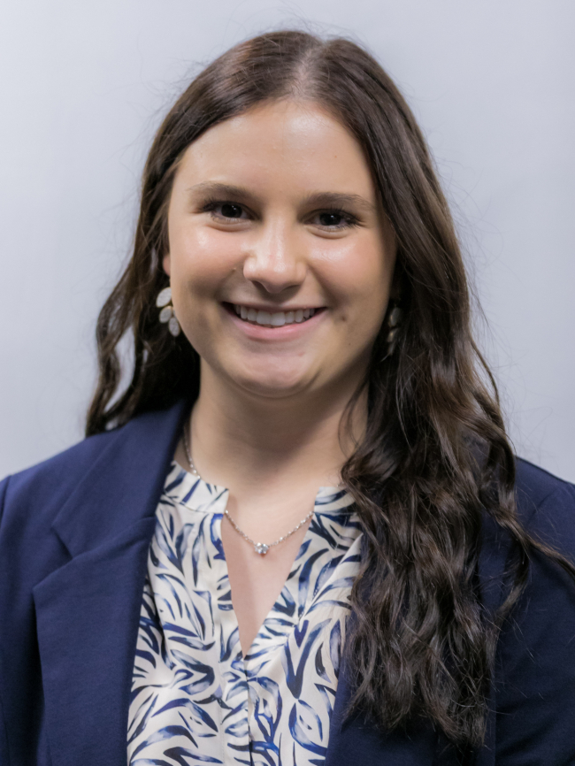 A headshot of Emma Scott-Wellman.