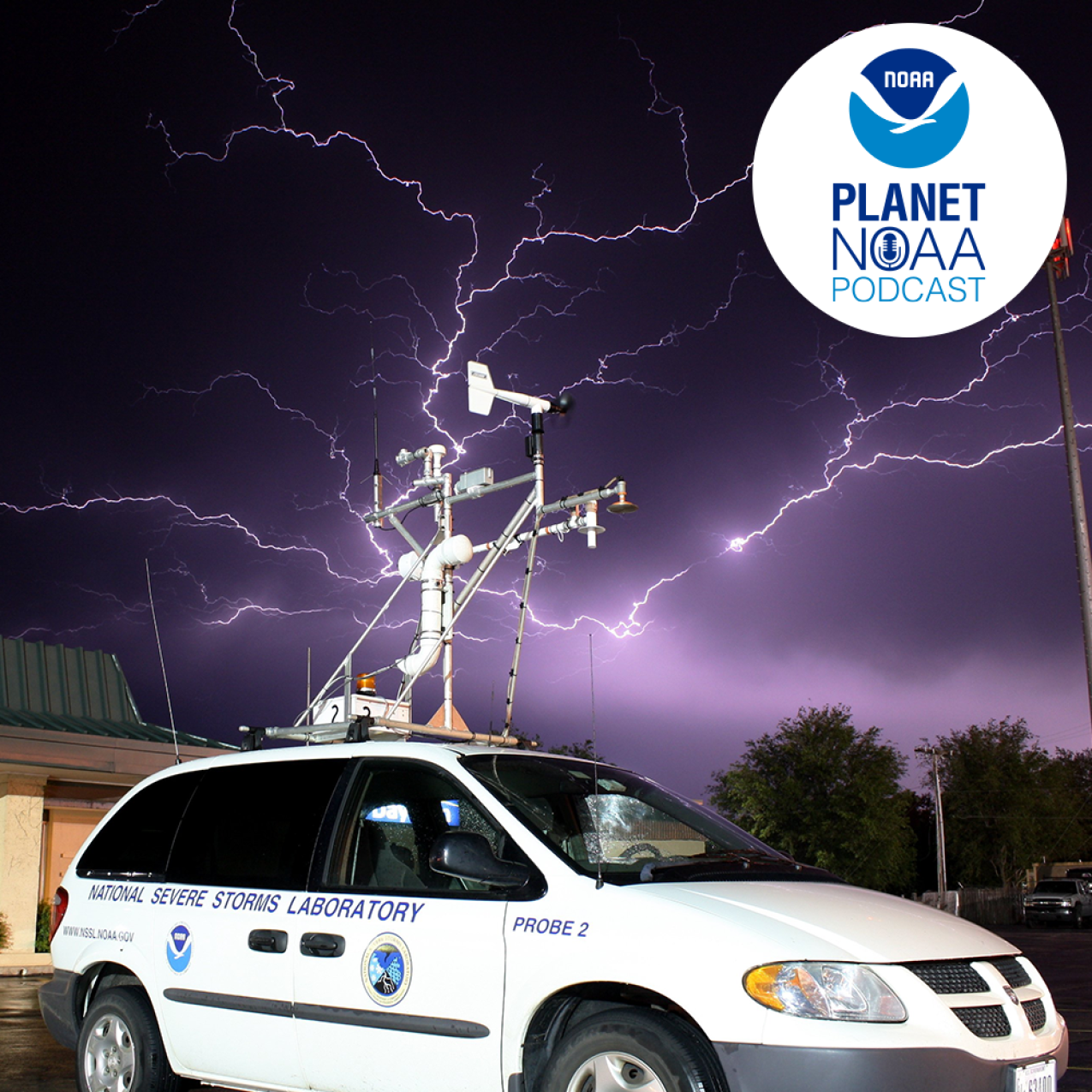 A National Severe Storms Laboratory observing vehicle takes measurements as lightning strikes in the background. Credit: NSSL.